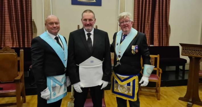 Initiate Ian Craven (centre).